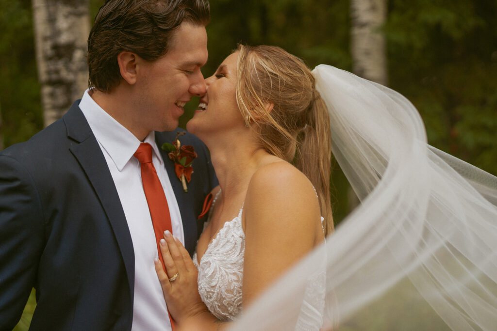 Bride and Groom Kissing Photo during their wedding near Edson, Alberta