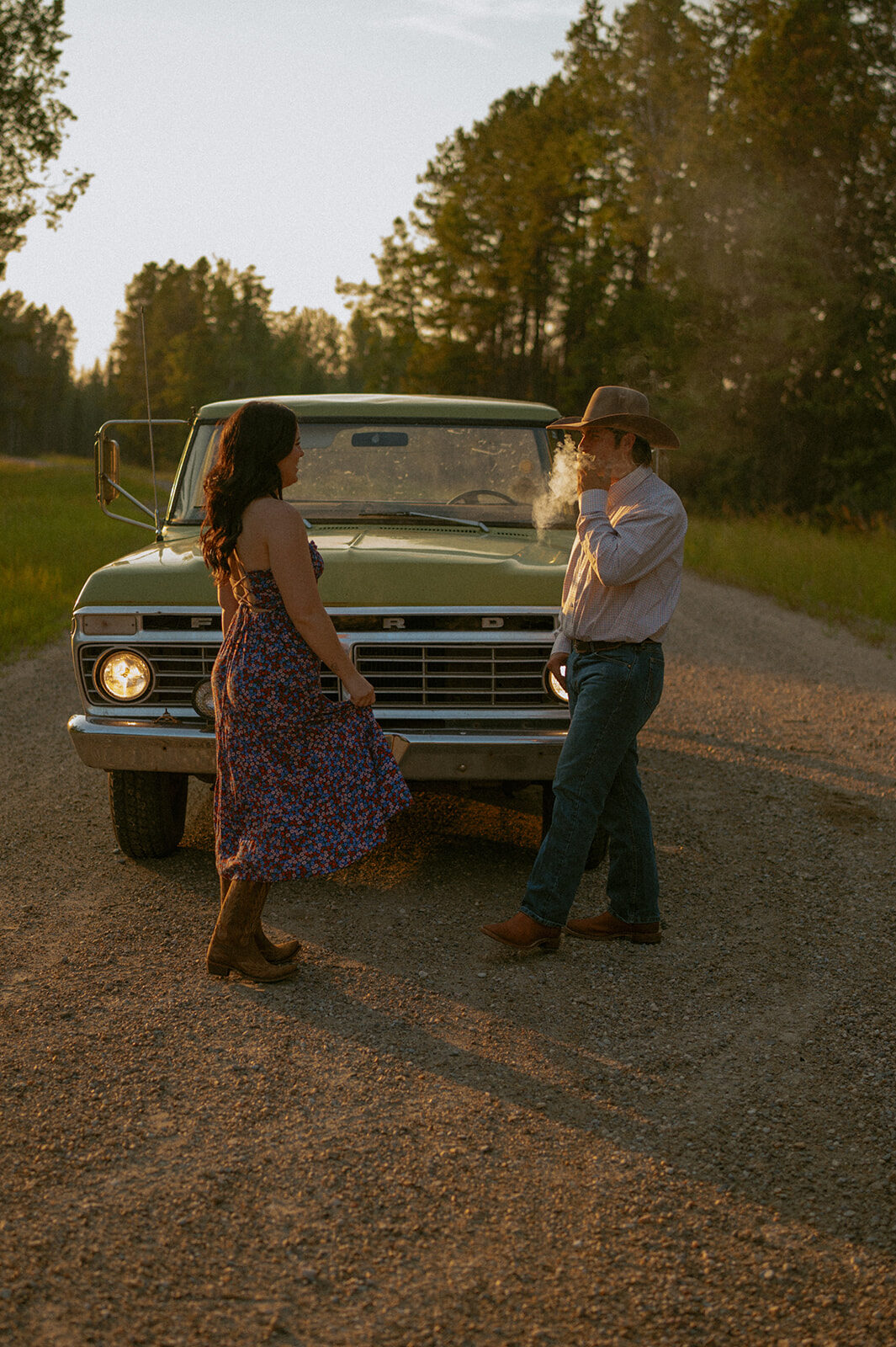 Western Couple at Sunset in front of old Green Ford Truck