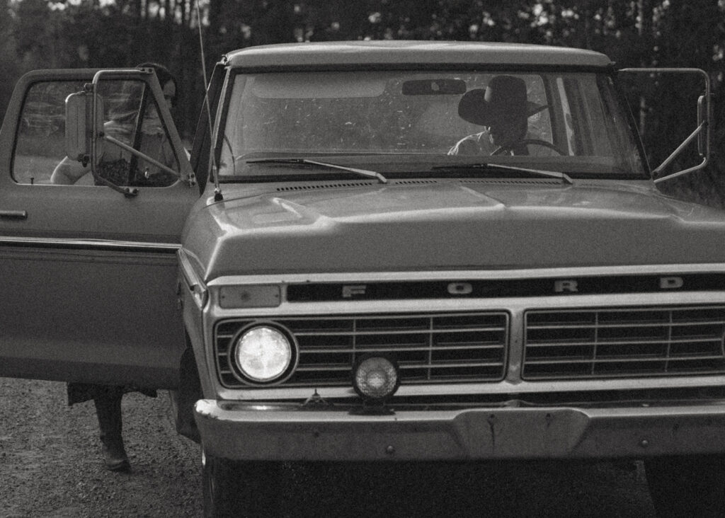 Couple in Old Ford Truck on a dirt road near Edson Alberta