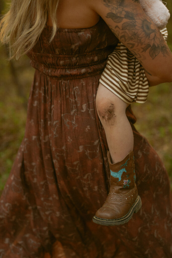 mother and daughter photo with dirt on knee