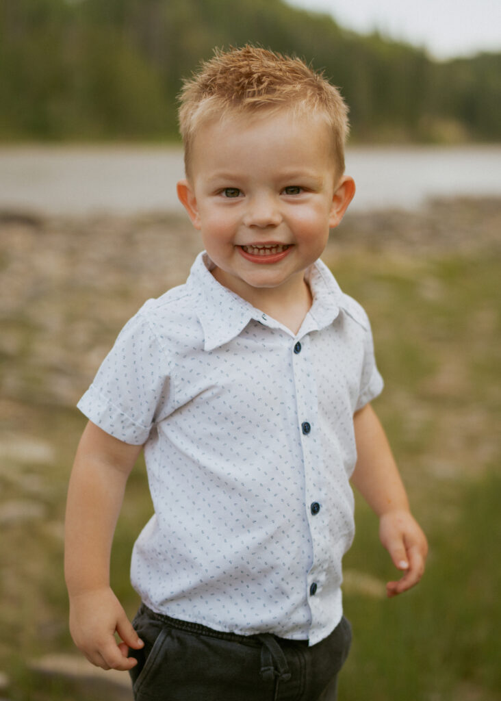 photo of toddler boy at river