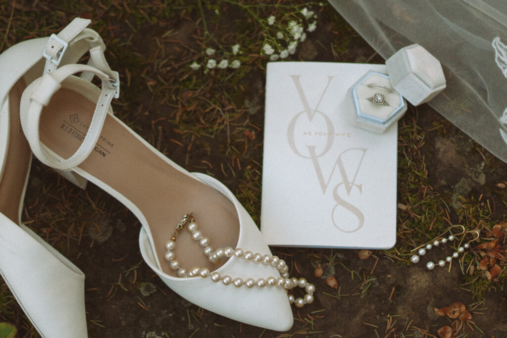 Detail Photo of Bride's Jewelry and Shoes on Moss