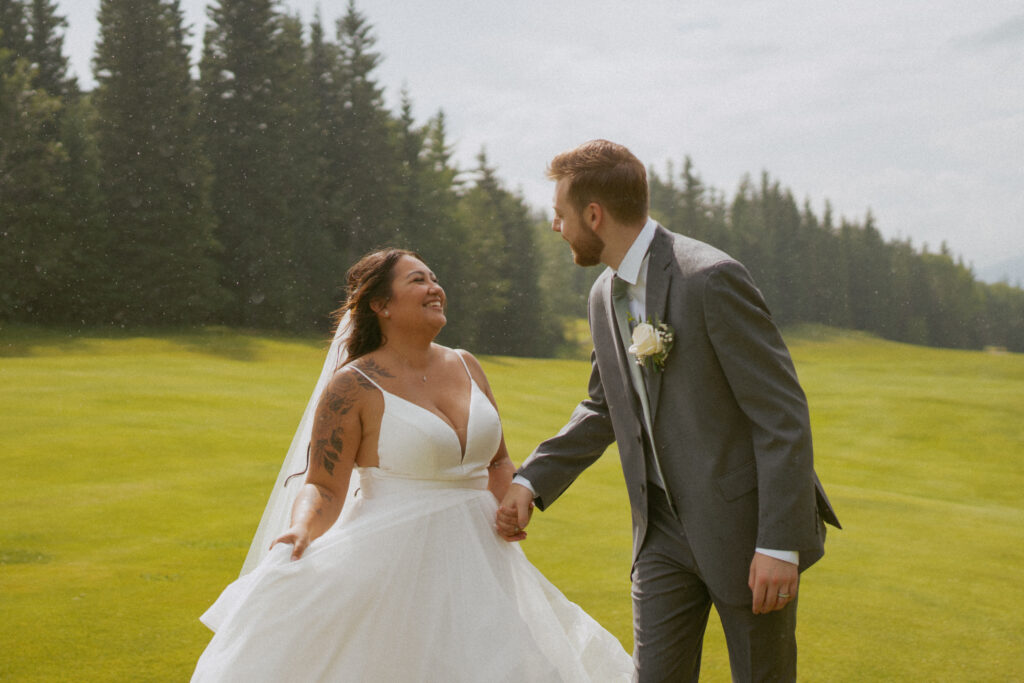Rainy and romantic moment from Sean and Kayla’s Hinton Alberta wedding.
