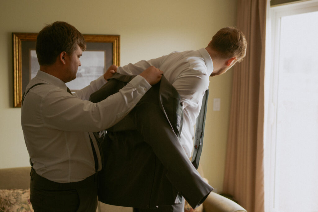 Groom preparing for his Hinton Alberta wedding at the golf club.