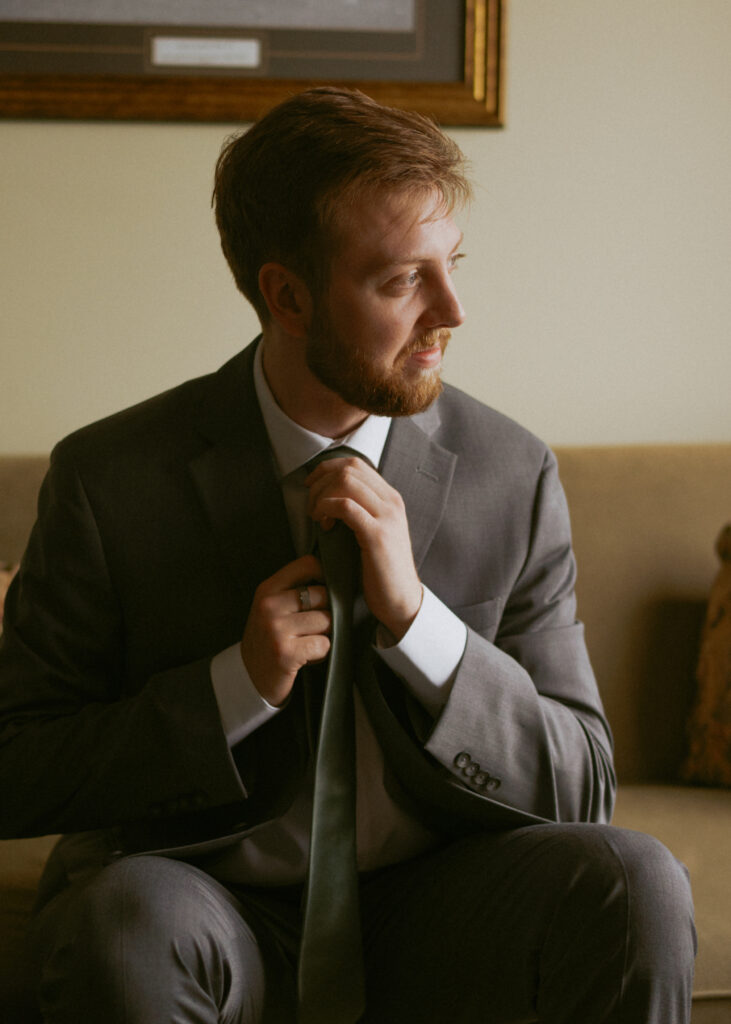 Groom preparing for his Hinton Alberta wedding at the golf club.