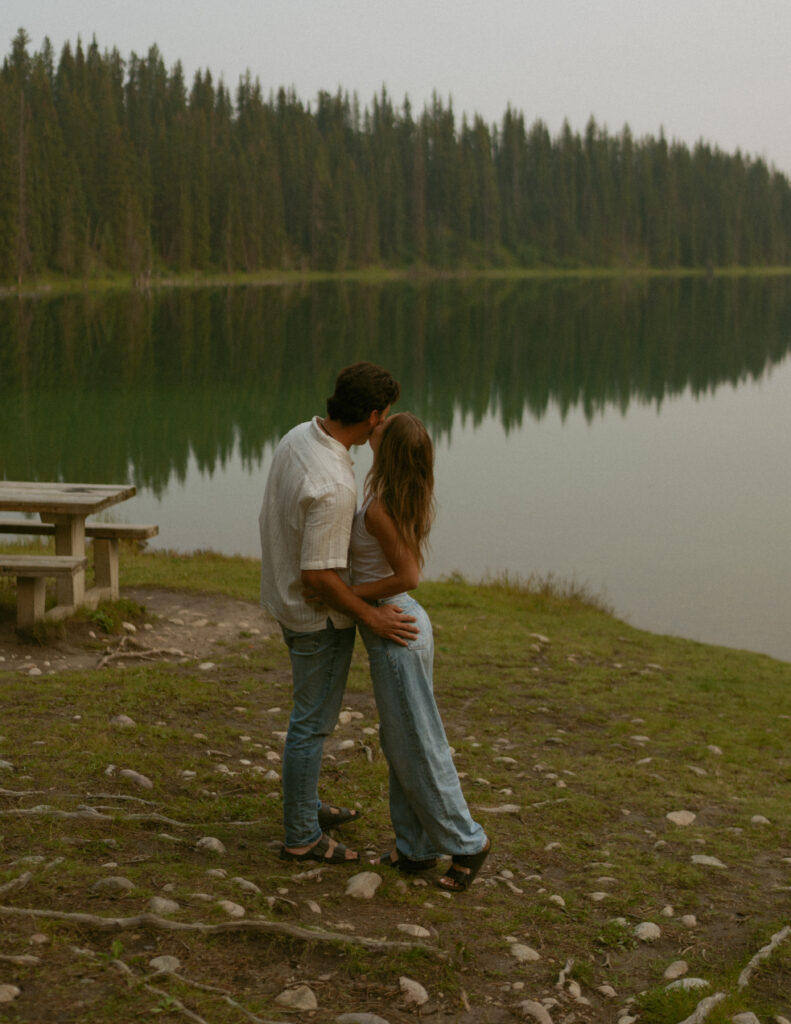 Intimate lakeside moment captured by an Edmonton wedding photographer.