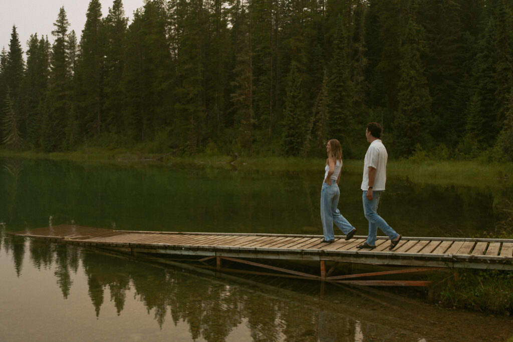 Playful forest engagement session by an Edmonton wedding photographer.