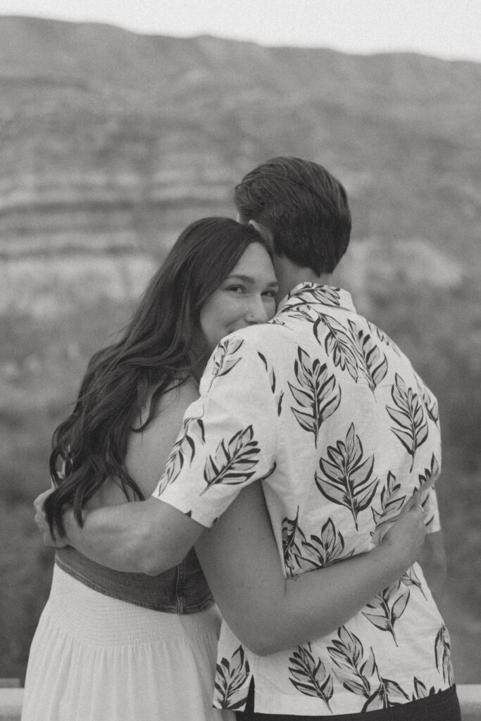 Romantic sunset kiss in the Alberta hoodoos by Drumheller wedding photographer Jordan’s Photos & Films.