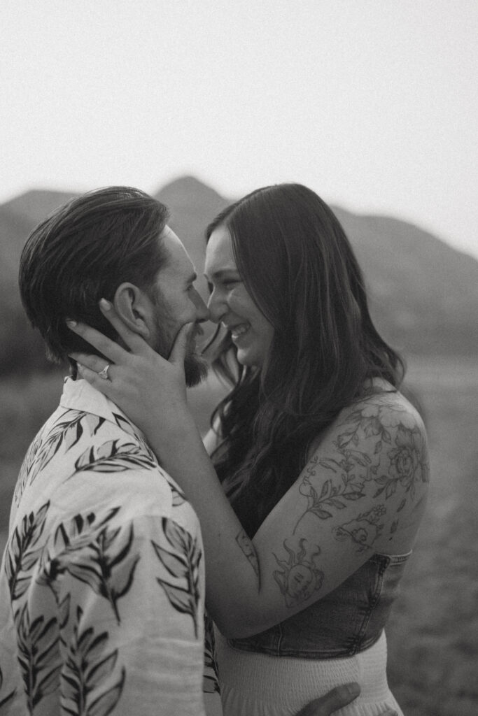 Romantic sunset kiss in the Alberta hoodoos by Drumheller wedding photographer Jordan’s Photos & Films.