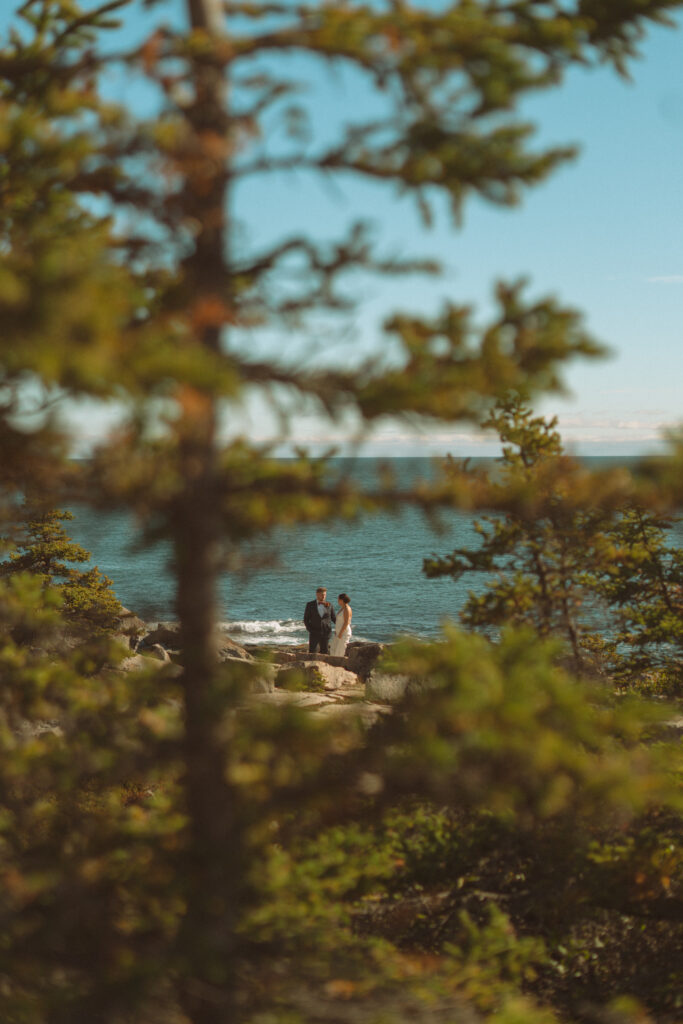 Intimate moment during Keith and Molly’s coastal Acadia elopement.