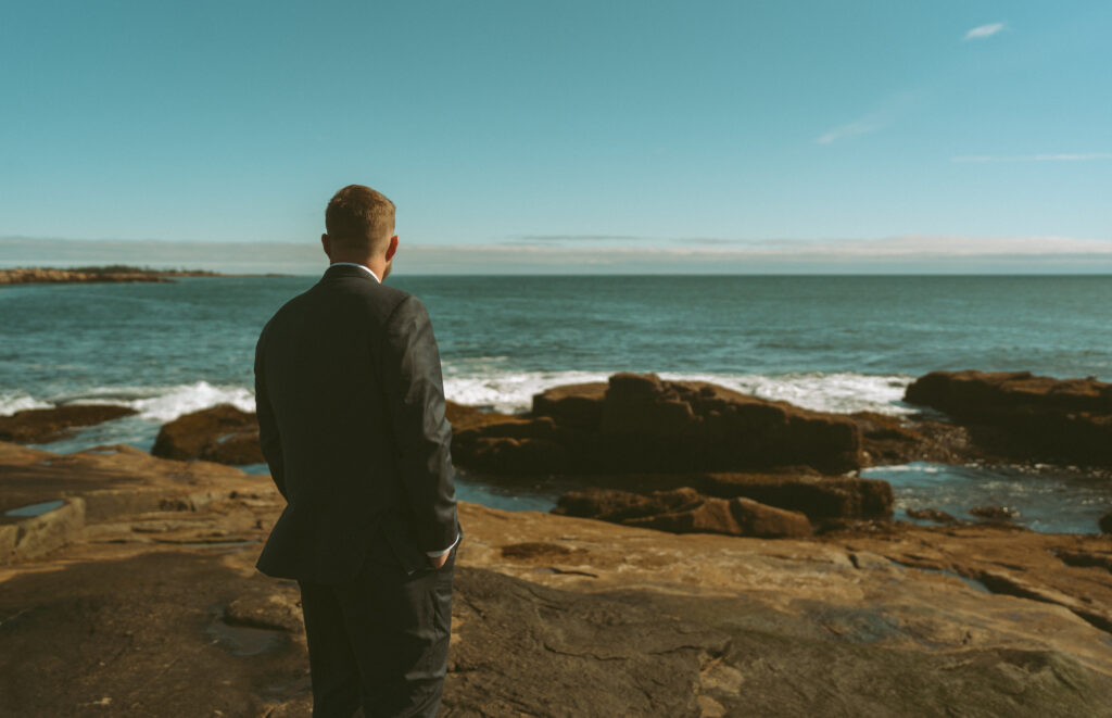 Bride and groom sharing vows at their Acadia National Park wedding.