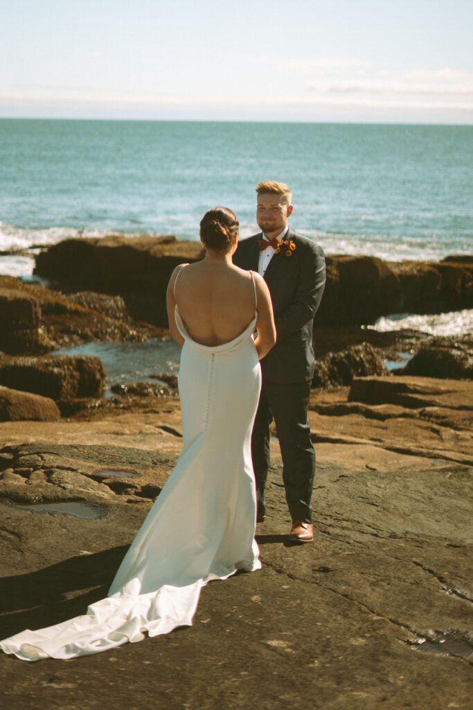 Bride and groom sharing vows at their Acadia National Park wedding.