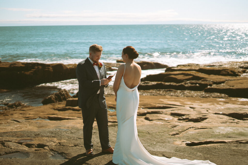 Bride and groom sharing vows at their Acadia National Park wedding.