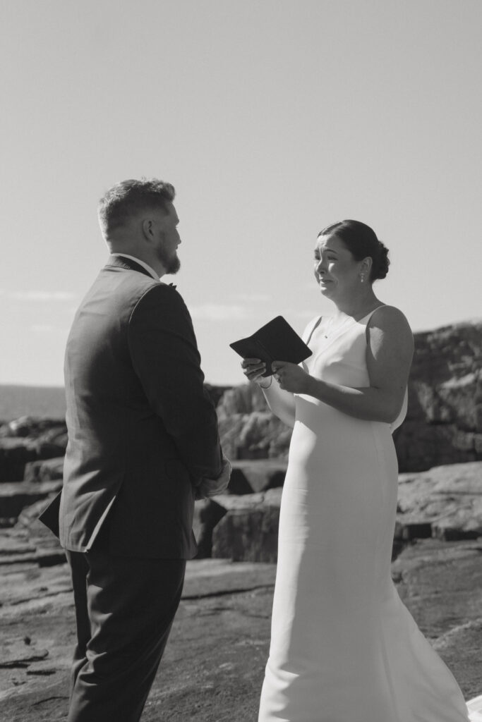 Bride and groom sharing vows at their Acadia National Park wedding.