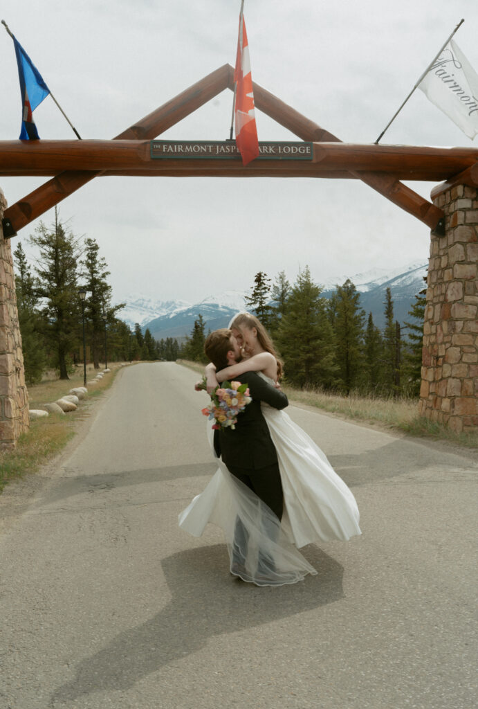 Romantic bridal portraits with mountain views at Fairmont Jasper Park Lodge.