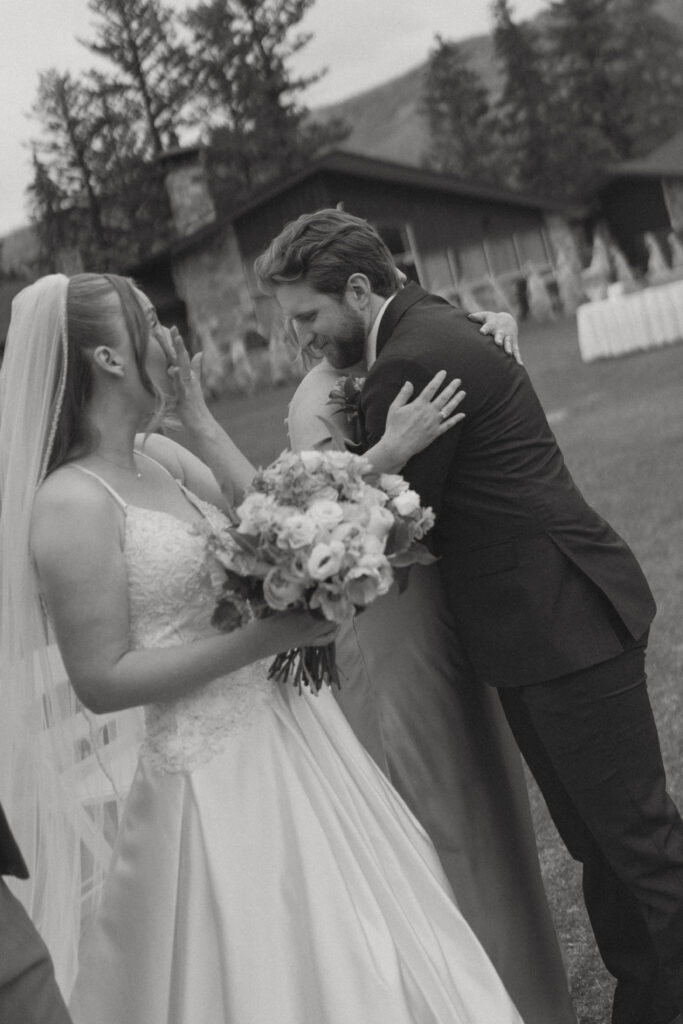 Wedding ceremony overlooking the Canadian Rockies at Fairmont Jasper Park Lodge.