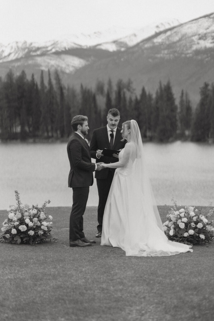 Wedding ceremony overlooking the Canadian Rockies at Fairmont Jasper Park Lodge.