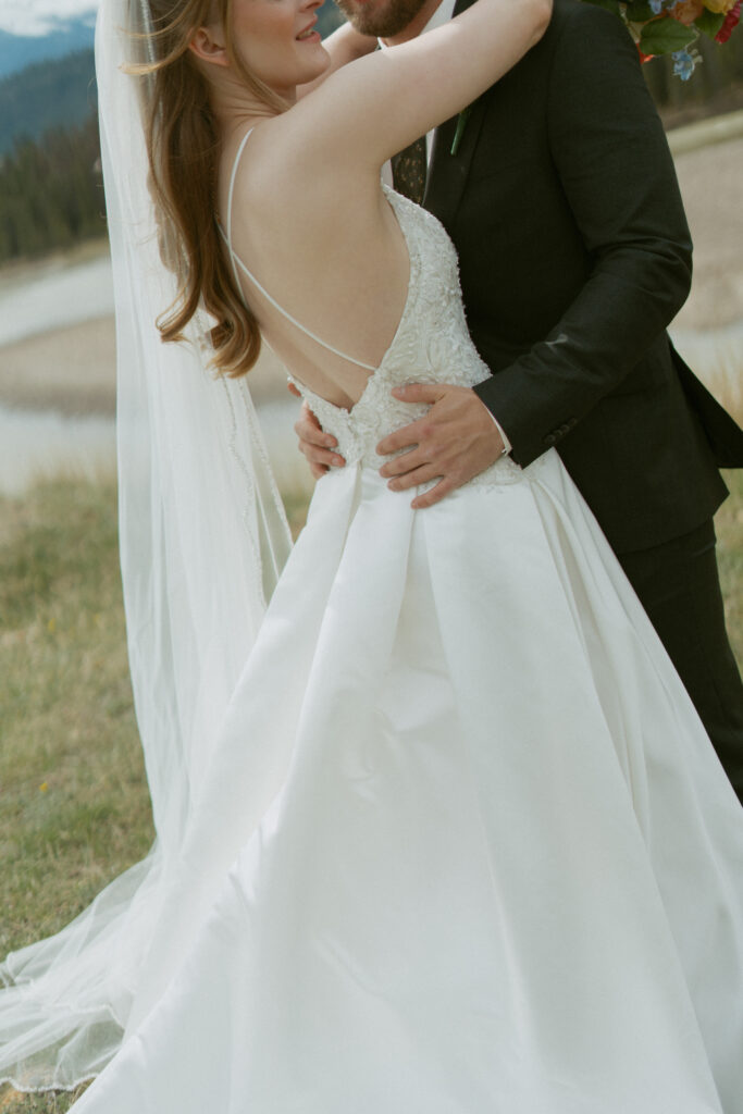 Romantic bridal portraits with mountain views at Fairmont Jasper Park Lodge.