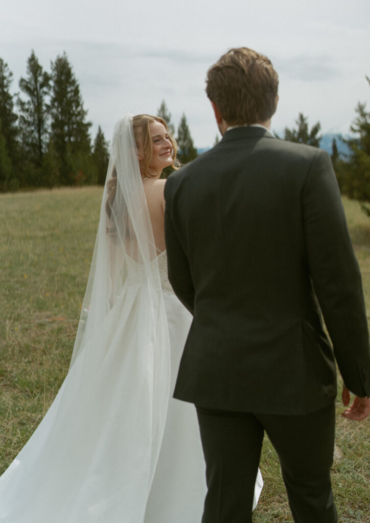Romantic bridal portraits with mountain views at Fairmont Jasper Park Lodge.