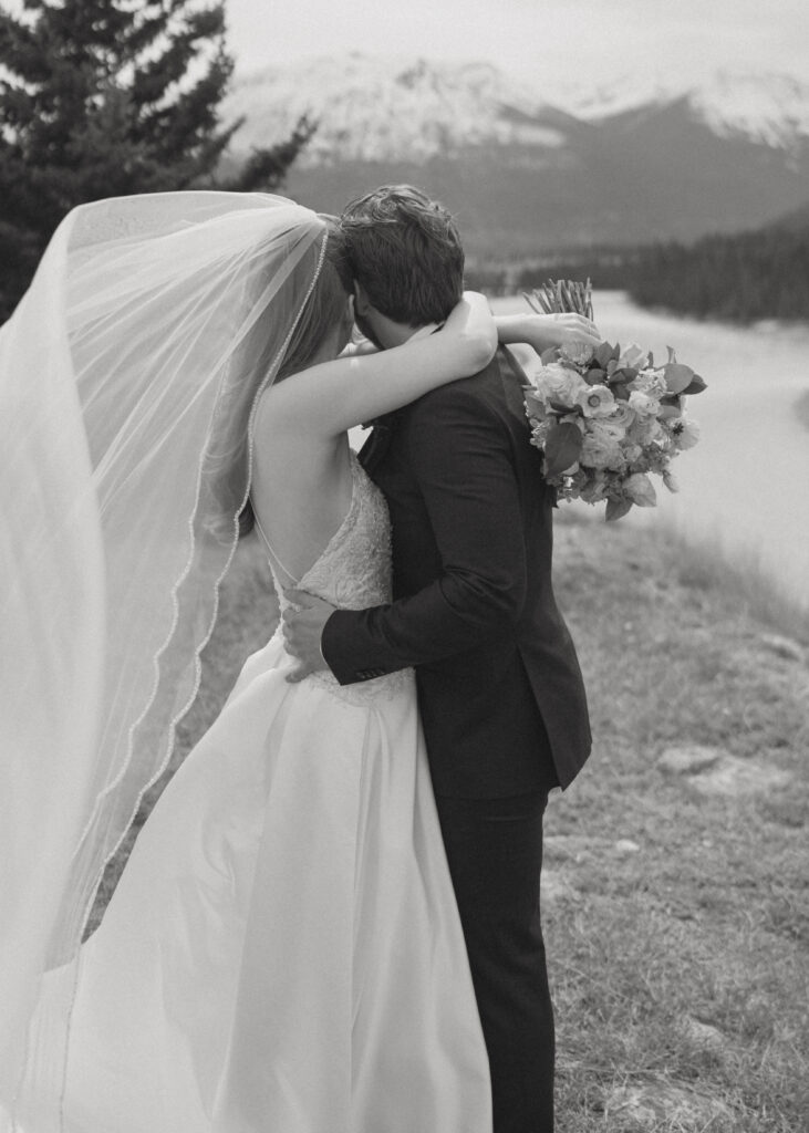 Romantic bridal portraits with mountain views at Fairmont Jasper Park Lodge.