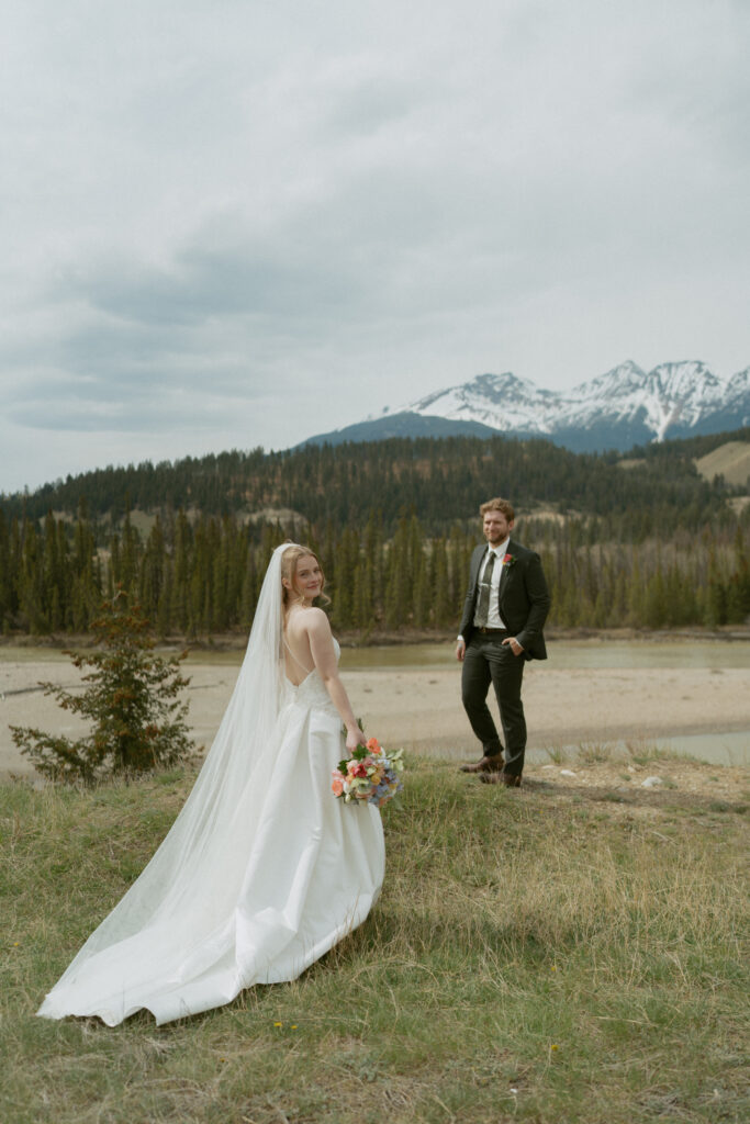 Romantic bridal portraits with mountain views at Fairmont Jasper Park Lodge.
