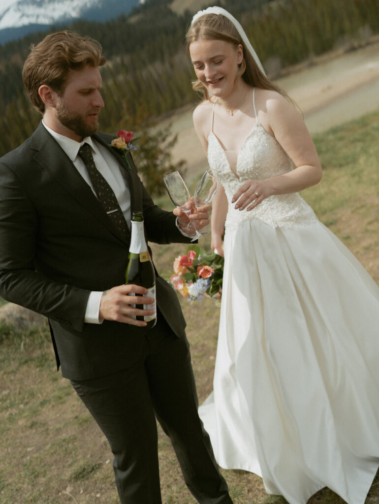 Romantic bridal portraits with mountain views at Fairmont Jasper Park Lodge.