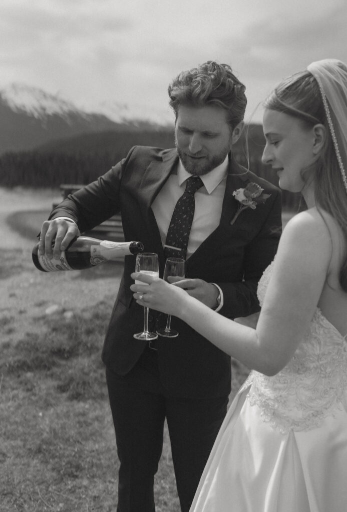 Romantic bridal portraits with mountain views at Fairmont Jasper Park Lodge.