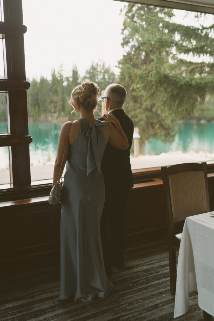 Elegant reception table decorated with candles and spring florals at Fairmont Jasper Park Lodge.